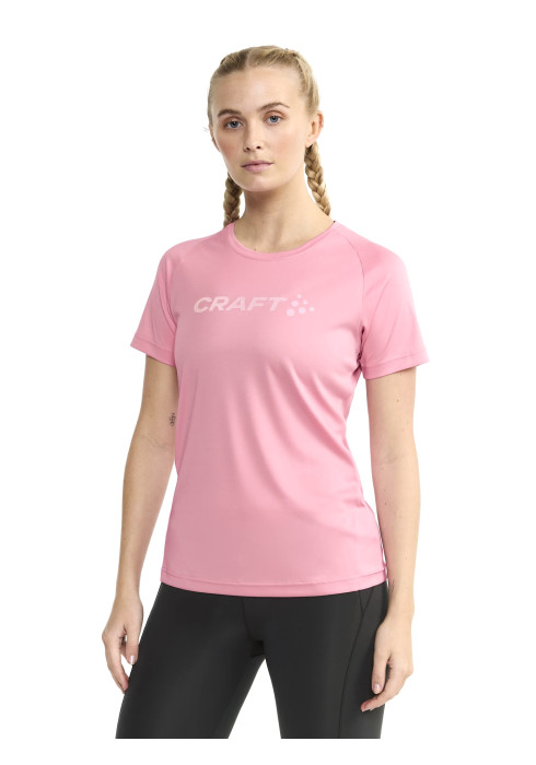 Жіноча футболка CRAFT Core Essence Logo Tee W яскраво-рожевого кольору. Виготовлена зі 100% переробленого поліестеру, має функціональні бічні шви, вигнуті вперед, та великий логотип CRAFT на грудях. Магазин LikeSport.