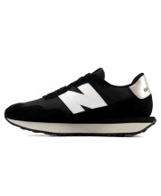 Жіночі чорні кросівки New Balance NB 237 у профіль з внутрішньої сторони з білим логотипом та сріблястою п'ятою