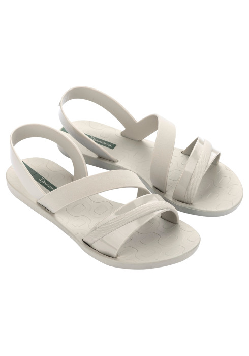 Пара жіночих світло-бежевих сандалів Ipanema Vibrant Sandal Fem з комбінованими ремінцями та зеленим логотипом