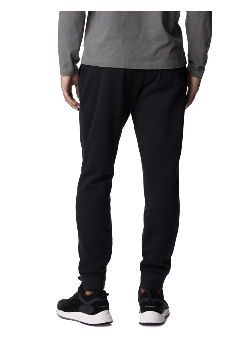 Чоловік у сірому лонгсліві та чорних спортивних штанах Columbia CSC Logo Fleece Jogger II вид ззаду на білому тлі