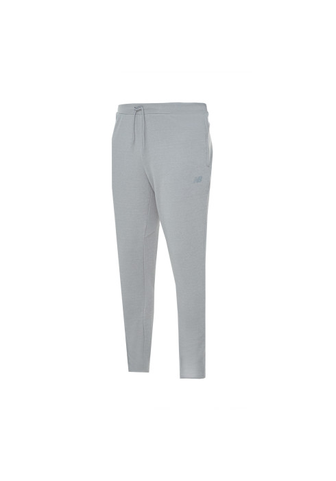 Сірі чоловічі спортивні штани New Balance Tech Knit NB DRY студійний вигляд спереду на білому тлі