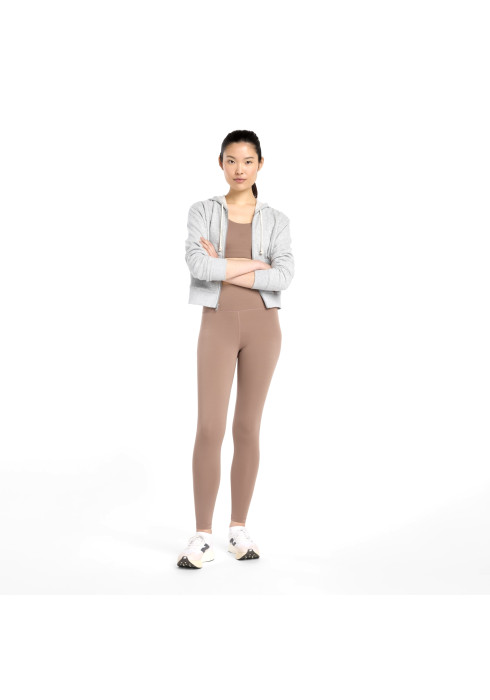 Жіночі бежеві тайтси New Balance NB Define у комплекті з топом та світлою курткою на моделі у повний зріст
