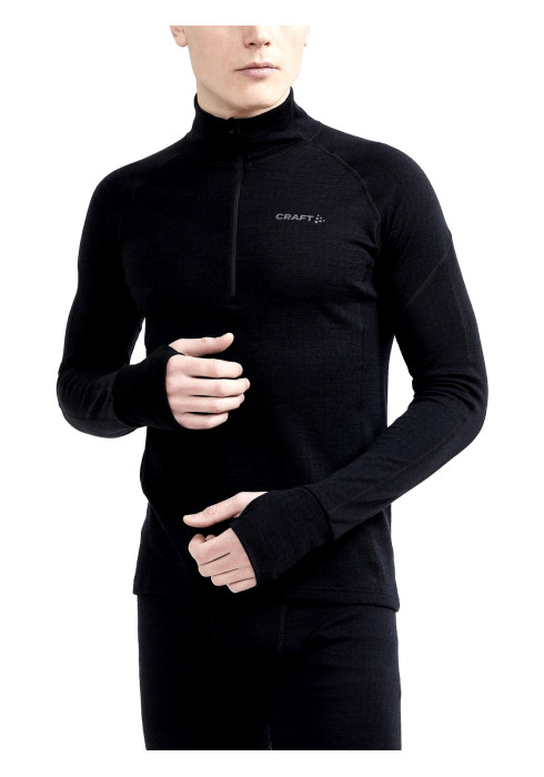 Чоловік у чорній термокофті Craft ADV Nordic Wool HZ з високим коміром та довгими рукавами спереду